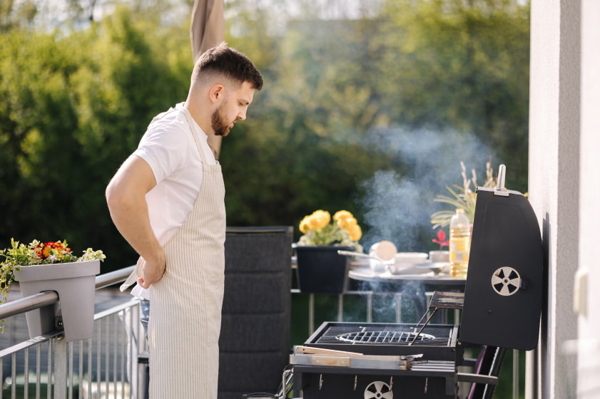 Man Prepping for BBQ Grill Deep Clean