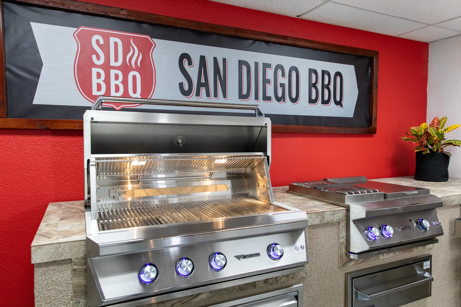 Built-in grills set into finished islands in the San Diego BBQ showroom