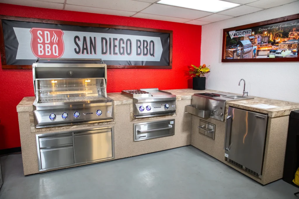 Inside the San Diego BBQ showroom, built-in grills set into a finished island