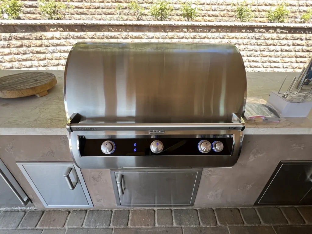 New Fire Magic Echelon E790i built-in grill installed in an outdoor kitchen island