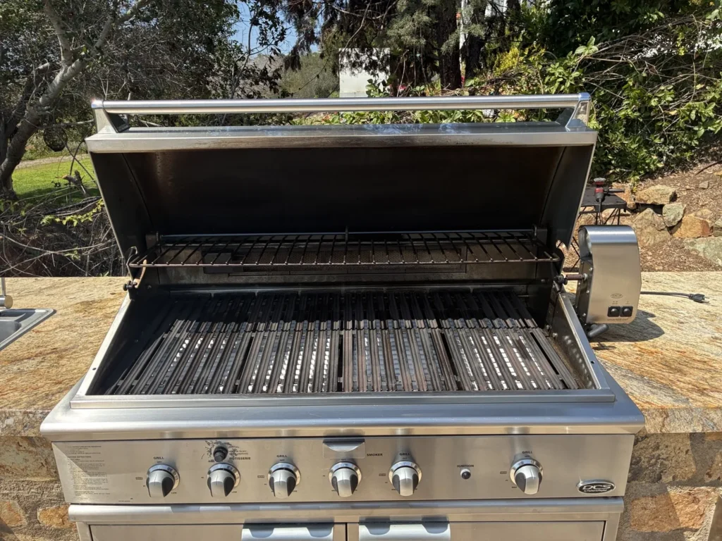 A large DCS grill after service with new stainless briquette trays and electrodes fitted