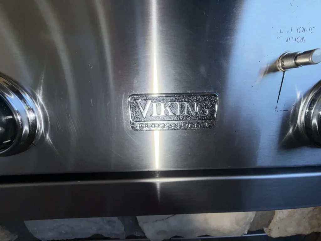 Polished Viking Professional badge on the control panel of a cleaned grill